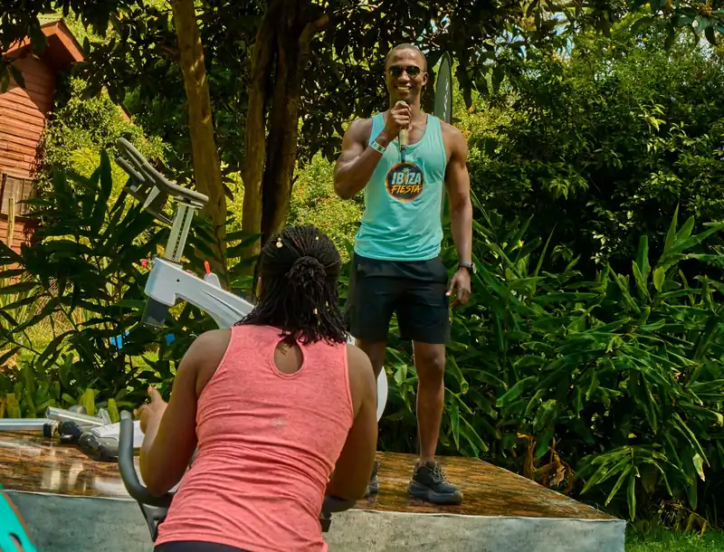 An emcee leading a session at an outdoor wellness event