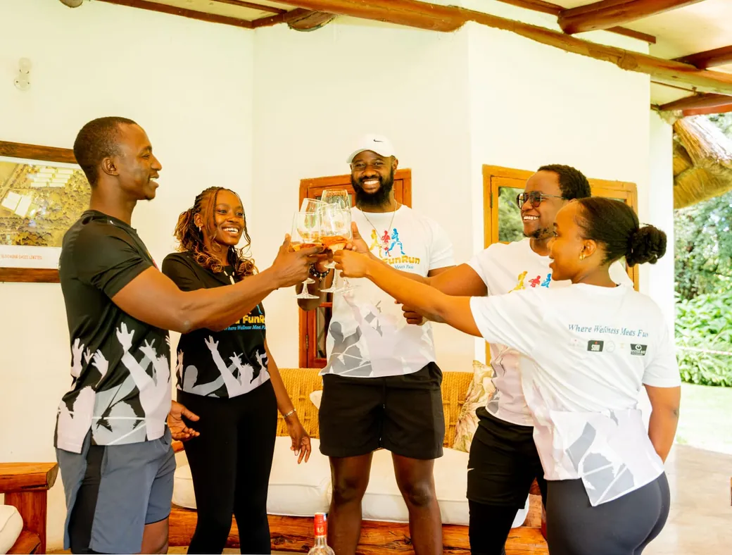 A small team toasting together after a company fitness event